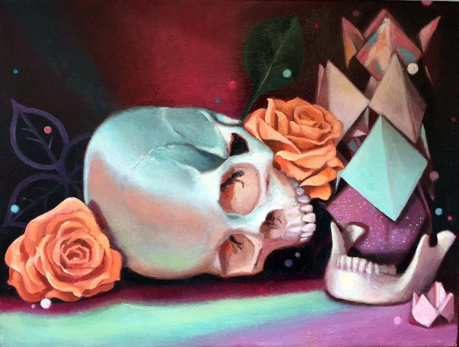 Contemporary vanitas still life oil painting by Philadelphia, PA artist Elizabeth Virginia Levesque. The top half of a white skull rests on its side in the center of the composition. In the right corner its the lower mandible. Orange roses, green leaves and a stack of colorful folded paper fortune tellers/cootie catchers frame the work. The still life is lit with surreal pink and green lighting.